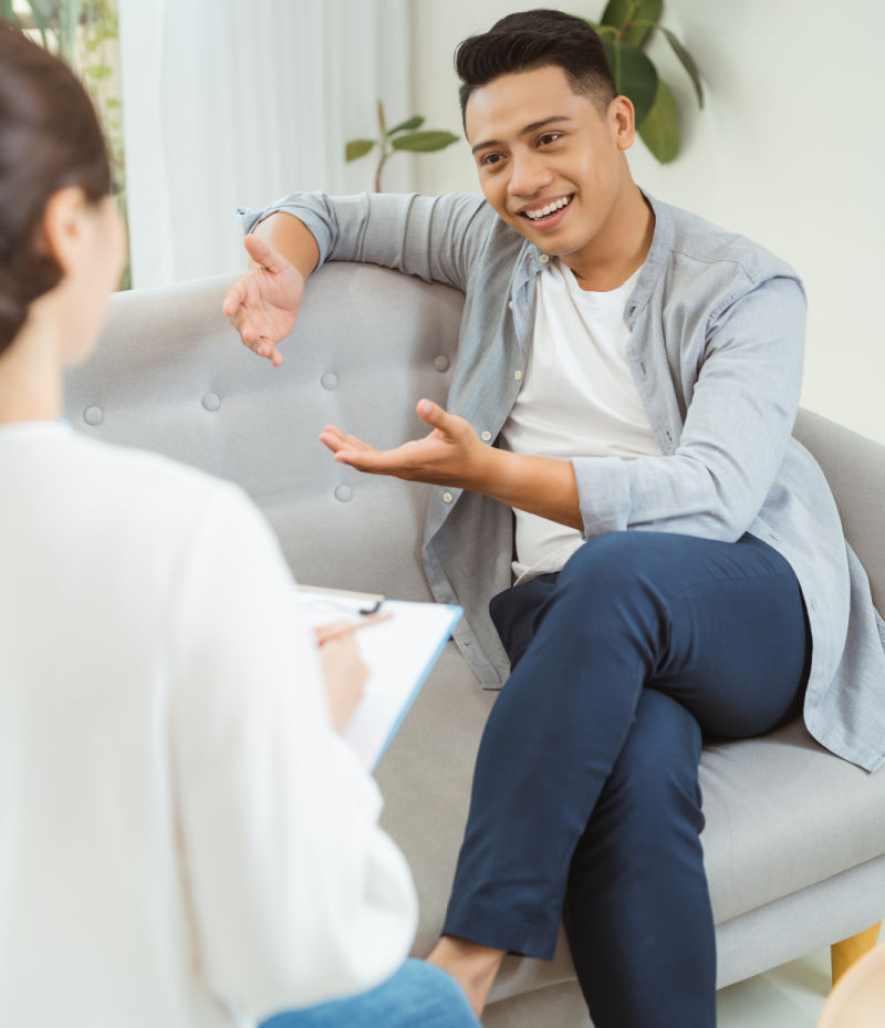 Female psychologist with client in office